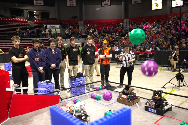 Members of Golden Ratio Robotics and The Techineers compete in the championship round.